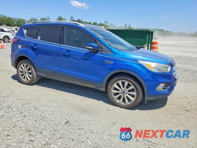 Czwarte zdjęcie samochodu z boku: 2017 FORD ESCAPE TITANIUM VIN:1FMCU0JD0HUC13274 - miniatura