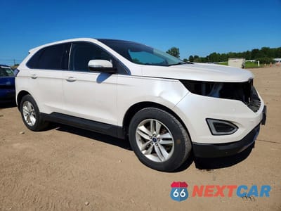 Czwarte zdjęcie samochodu z boku: 2015 FORD EDGE SEL VIN:2FMTK4J83FBB95999 - miniatura