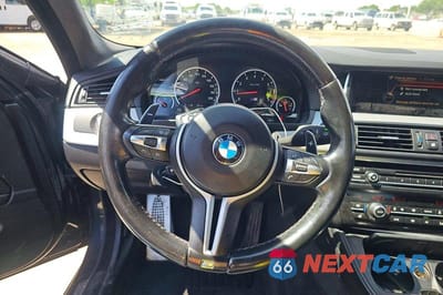 Zdjęcie 11 z 14 samochodu: 2016 BMW M5 VIN:WBSFV9C55GD595740 - miniatura
