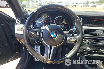 Zdjęcie 11 z 14 samochodu: 2016 BMW M5 VIN:WBSFV9C55GD595740 - miniatura