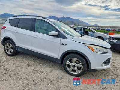 Czwarte zdjęcie samochodu z boku: 2016 FORD ESCAPE SE VIN:1FMCU0GXXGUC11824 - miniatura