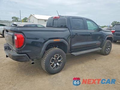 Trzecie zdjęcie samochodu z tyłu: 2024 GMC CANYON AT4X VIN:1GTP6EEK3R1258606 - miniatura