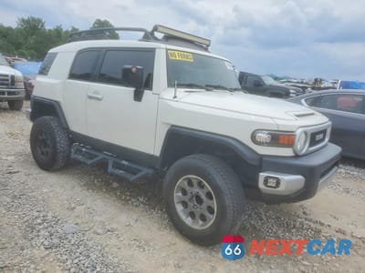 Czwarte zdjęcie samochodu z boku: 2011 TOYOTA FJ CRUISER BASE VIN:JTEBU4BFXBK104312 - miniatura