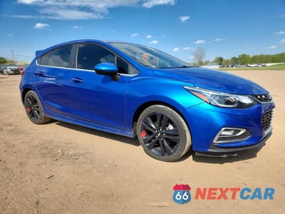 Czwarte zdjęcie samochodu z boku: 2017 CHEVROLET CRUZE LT VIN:3G1BE6SM5HS550594 - miniatura