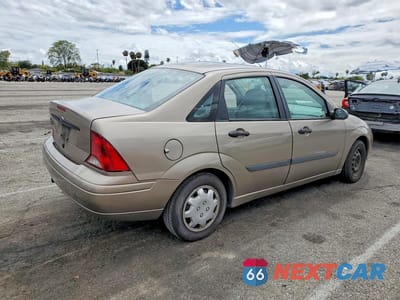Trzecie zdjęcie samochodu z tyłu: 2003 FORD FOCUS LX VIN:1FAFP33Z63W329438 - miniatura