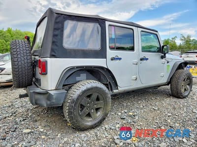 Trzecie zdjęcie samochodu z tyłu: 2010 JEEP WRANGLER UNLIMITED SPORT VIN:1J4BA3H11AL218110 - miniatura