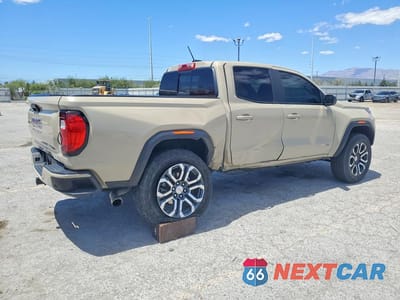 Trzecie zdjęcie samochodu z tyłu: 2024 GMC CANYON AT4 VIN:1GTP6DEK7R1160754 - miniatura