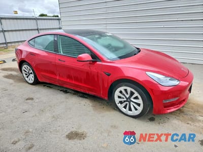 Czwarte zdjęcie samochodu z boku: 2022 TESLA MODEL 3 VIN:5YJ3E1EB6NF286833 - miniatura
