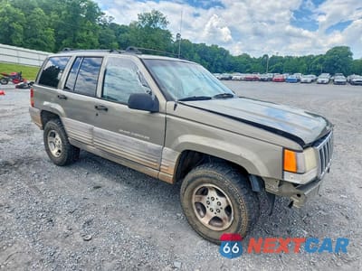 Czwarte zdjęcie samochodu z boku: 1998 JEEP GRAND CHEROKEE LAREDO VIN:1J4GZ58S4WC270230 - miniatura