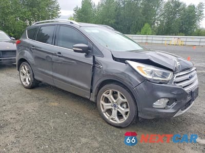 Czwarte zdjęcie samochodu z boku: 2019 FORD ESCAPE TITANIUM VIN:1FMCU9J95KUC05484 - miniatura