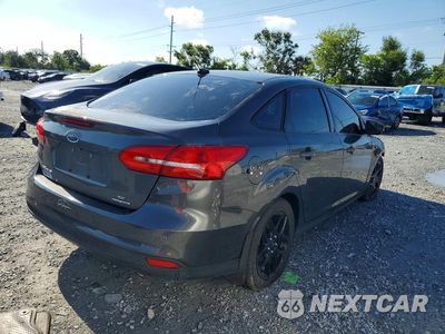 Trzecie zdjęcie samochodu z tyłu: 2016 FORD FOCUS VIN:1FADP3F24GL236463 - miniatura