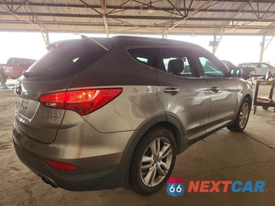 Trzecie zdjęcie samochodu z tyłu: 2013 HYUNDAI SANTA FE SPORT 2.0T VIN:5XYZU3LA1DG084184 - miniatura