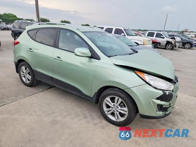 Czwarte zdjęcie samochodu z boku: 2011 HYUNDAI TUCSON GLS VIN:KM8JU3AC7BU125930 - miniatura