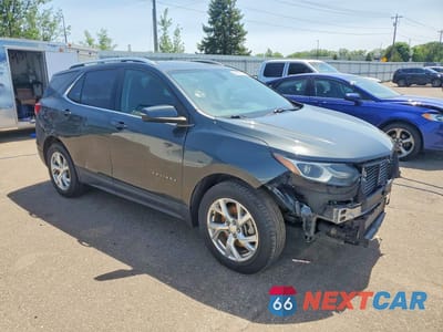 Czwarte zdjęcie samochodu z boku: 2018 CHEVROLET EQUINOX LT VIN:3GNAXKEX3JS607934 - miniatura