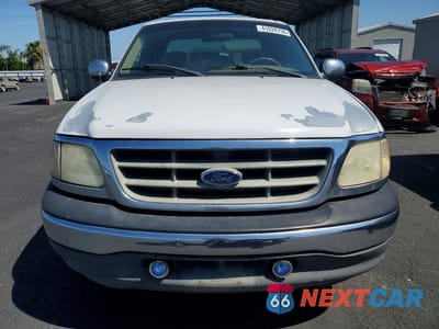 Piąte zdjęcie samochodu w środku: 2001 FORD F150 VIN:1FTRX07L71KF68268 - miniatura
