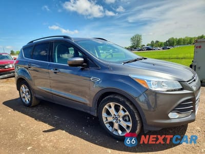 Czwarte zdjęcie samochodu z boku: 2016 FORD ESCAPE SE VIN:1FMCU9GXXGUC07499 - miniatura