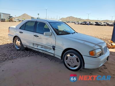 Czwarte zdjęcie samochodu z boku: 1999 MERCEDES-BENZ C 43 VIN:WDBHA33G2XF850129 - miniatura