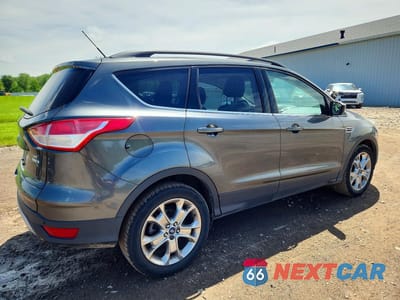 Trzecie zdjęcie samochodu z tyłu: 2016 FORD ESCAPE SE VIN:1FMCU9GXXGUC07499 - miniatura