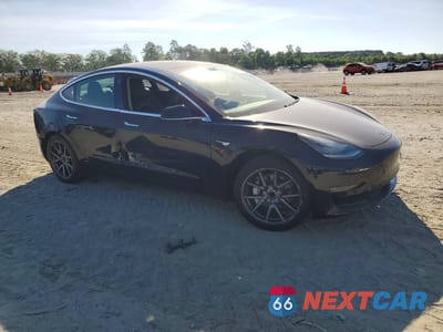 Czwarte zdjęcie samochodu z boku: 2019 TESLA MODEL 3 VIN:5YJ3E1EA4KF410603 - miniatura