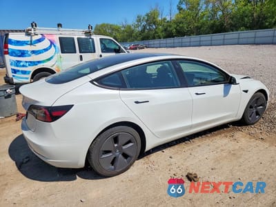 Trzecie zdjęcie samochodu z tyłu: 2023 TESLA MODEL 3 VIN:5YJ3E1EA9PF501177 - miniatura