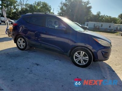 Czwarte zdjęcie samochodu z boku: 2011 HYUNDAI TUCSON GLS VIN:KM8JUCAC5BU243569 - miniatura