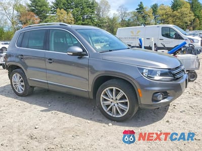 Czwarte zdjęcie samochodu z boku: 2014 VOLKSWAGEN TIGUAN S VIN:WVGBV3AX8EW618206 - miniatura