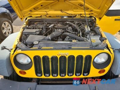 Zdjęcie 11 z 12 samochodu: 2011 JEEP WRANGLER VIN:1J4GA2D11BL533223 - miniatura