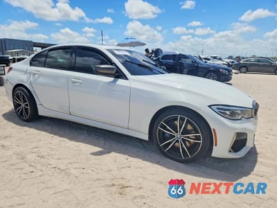 Czwarte zdjęcie samochodu z boku: 2020 BMW M340I VIN:WBA5U7C04LFH37458 - miniatura