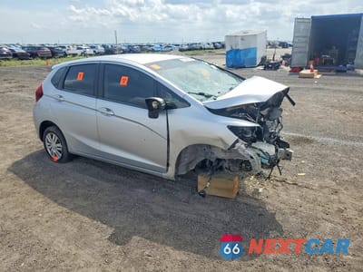 Czwarte zdjęcie samochodu z boku: 2015 HONDA FIT LX VIN:3HGGK5H59FM751918 - miniatura