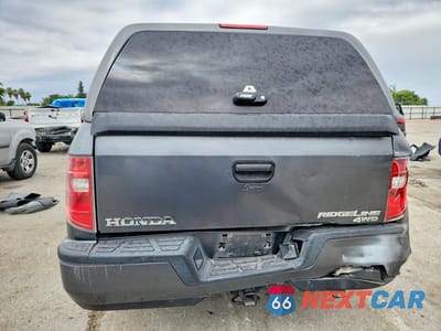 Zdjęcie 6 z 12 samochodu: 2010 HONDA RIDGELINE RT VIN:5FPYK1F2XAB010802 - miniatura