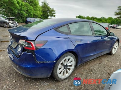 Trzecie zdjęcie samochodu z tyłu: 2022 TESLA MODEL 3 VIN:5YJ3E1EA3NF370499 - miniatura