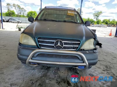 Piąte zdjęcie samochodu w środku: 1999 MERCEDES-BENZ ML 320 VIN:4JGAB54E4XA100703 - miniatura