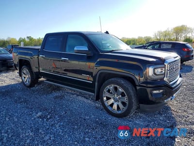Czwarte zdjęcie samochodu z boku: 2018 GMC SIERRA K1500 DENALI VIN:3GTU2PEJ6JG334794 - miniatura