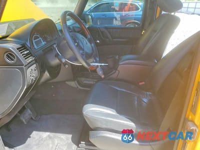 Zdjęcie 7 z 12 samochodu: 2003 MERCEDES-BENZ G 55 AMG VIN:WDCYR46E03X140865 - miniatura