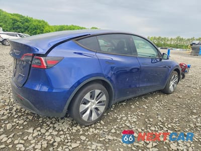 Trzecie zdjęcie samochodu z tyłu: 2023 TESLA MODEL Y VIN:7SAYGDEE7PA093430 - miniatura