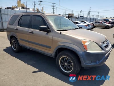 Czwarte zdjęcie samochodu z boku: 2004 HONDA CR-V LX VIN:JHLRD68404C021928 - miniatura