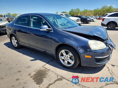 Czwarte zdjęcie samochodu z boku: 2009 VOLKSWAGEN JETTA SE VIN:3VWRM71K49M143979 - miniatura