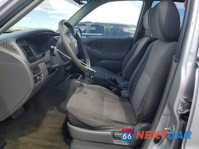 Zdjęcie 7 z 13 samochodu: 2000 CHEVROLET TRACKER VIN:2CNBJ13C0Y6939603 - miniatura