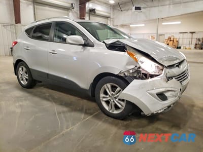 Czwarte zdjęcie samochodu z boku: 2011 HYUNDAI TUCSON GLS VIN:KM8JU3AC5BU160062 - miniatura