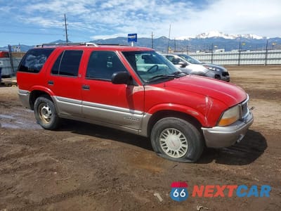 Czwarte zdjęcie samochodu z boku: 1998 GMC JIMMY VIN:1GKDT13W9W2544951 - miniatura
