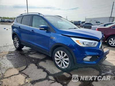 Czwarte zdjęcie samochodu z boku: 2017 FORD ESCAPE TITANIUM VIN:1FMCU0JD2HUE69531 - miniatura