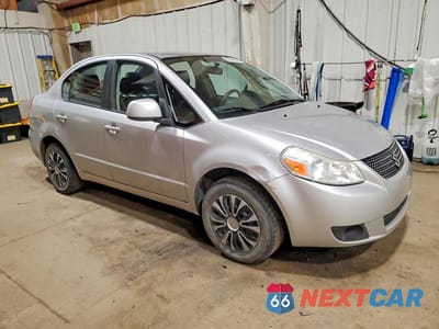 Czwarte zdjęcie samochodu z boku: 2012 SUZUKI SX4 LE VIN:JS2YC5A32C6303689 - miniatura
