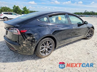 Trzecie zdjęcie samochodu z tyłu: 2022 TESLA MODEL 3 VIN:5YJ3E1EA0NF206918 - miniatura