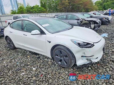 Czwarte zdjęcie samochodu z boku: 2023 TESLA MODEL 3 VIN:5YJ3E1EA9PF574596 - miniatura