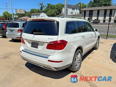 Czwarte zdjęcie samochodu z boku: 2014 MERCEDES-BENZ GL 450 4MATIC VIN:4JGDF7CE1EA304161 - miniatura