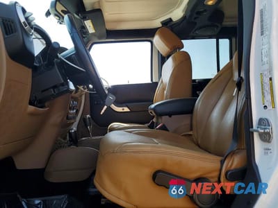 Zdjęcie 7 z 13 samochodu: 2014 JEEP WRANGLER UNLIMITED SAHARA VIN:1C4BJWEG0EL212501 - miniatura