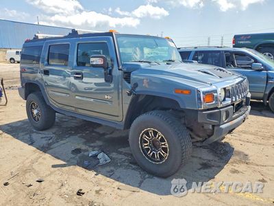 Czwarte zdjęcie samochodu z boku: 2005 HUMMER H2 VIN:5GRGN23U25H124398 - miniatura
