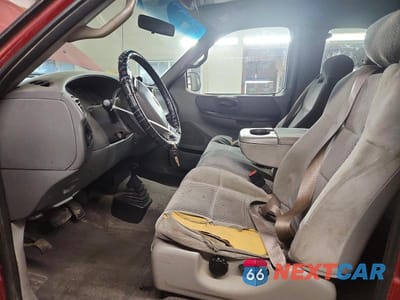 Zdjęcie 7 z 12 samochodu: 2001 FORD F150 VIN:1FTRX18L11NB36620 - miniatura