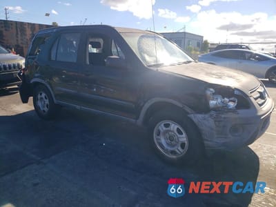 Czwarte zdjęcie samochodu z boku: 2005 HONDA CR-V LX VIN:JHLRD68555C006982 - miniatura