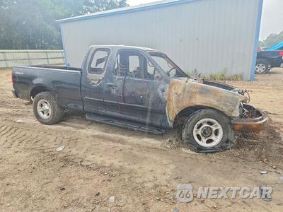 Czwarte zdjęcie samochodu z boku: 2002 FORD F150 VIN:1FTRX17L02NA64070 - miniatura